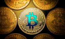 Coins with the bitcoin logo.