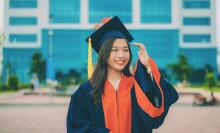 woman wearing graduation cap and gown