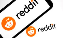 Reddit logo appears on a smartphone screen