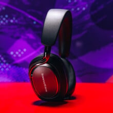 bowers & wilkins px8 s2 headphones stand up in front of purple background
