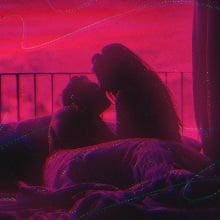 couple canoodling in bed