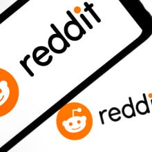 Reddit logo appears on a smartphone screen