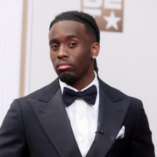 Cenat poses on the BET red carpet.