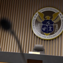 A microphone in front of the FCC briefing room table. 