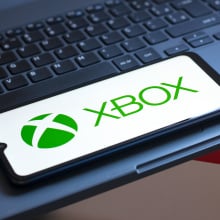 the XBOX logo is seen displayed on a smartphone screen