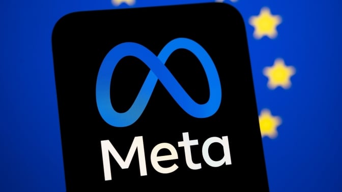 A phone showing the Meta logo in front of the European Union flag.