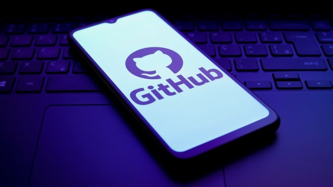 The GitHub logo appears on a smartphone screen in this illustration photo