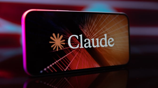 claude logo and name appears on a smartphone screen with colorful lights in background