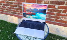 framework 16 laptop outside against a brick wall