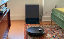 Dreame X60 Max Ultra Complete robot vacuum cleaning rug in front of dock